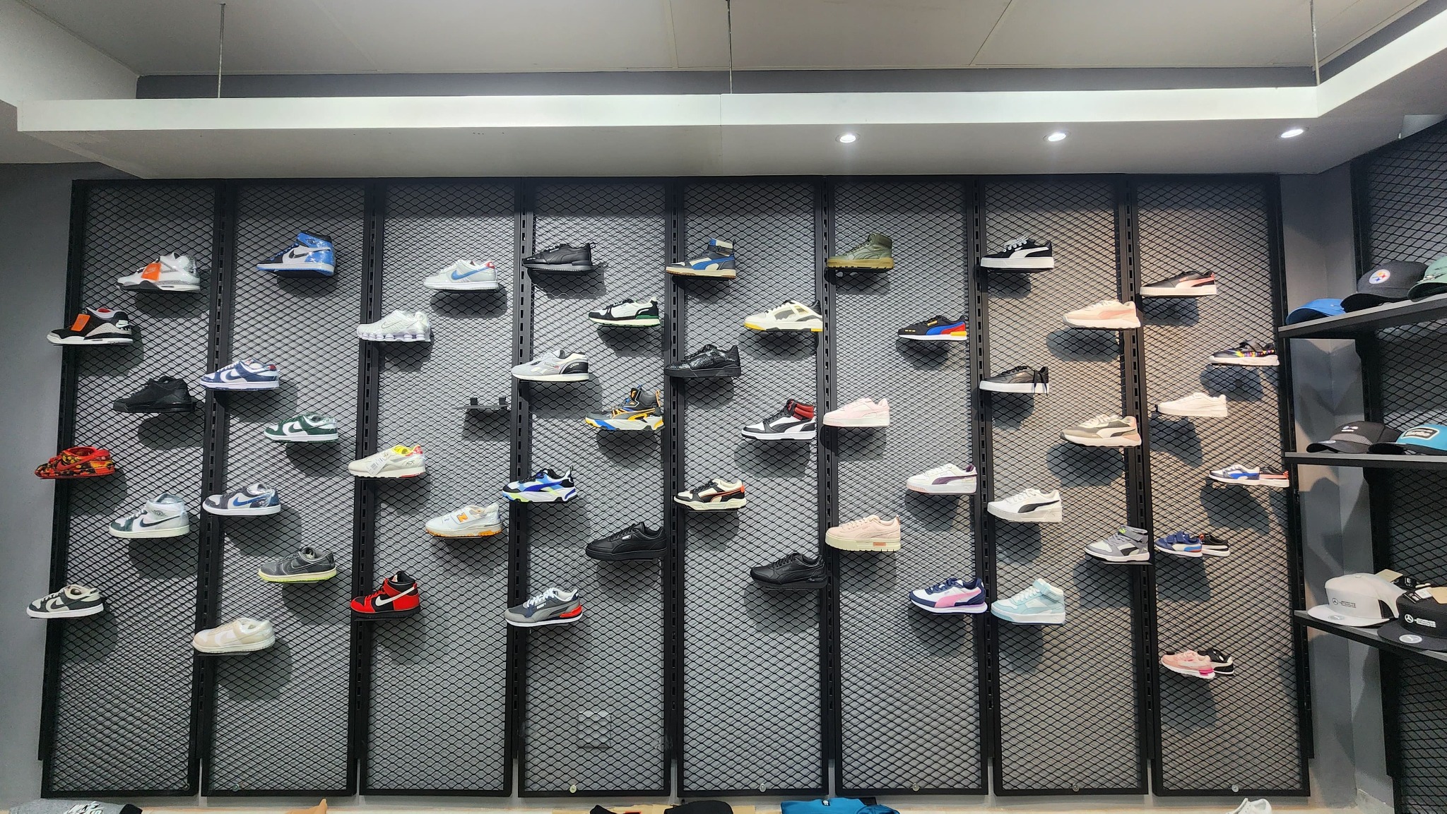 Footwear merchandising wall and retail display system